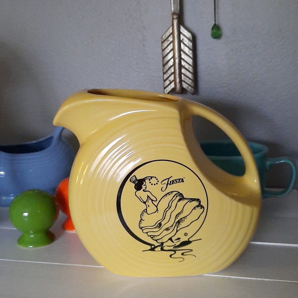 Pale yellow Fiestaware pitcher with dancer